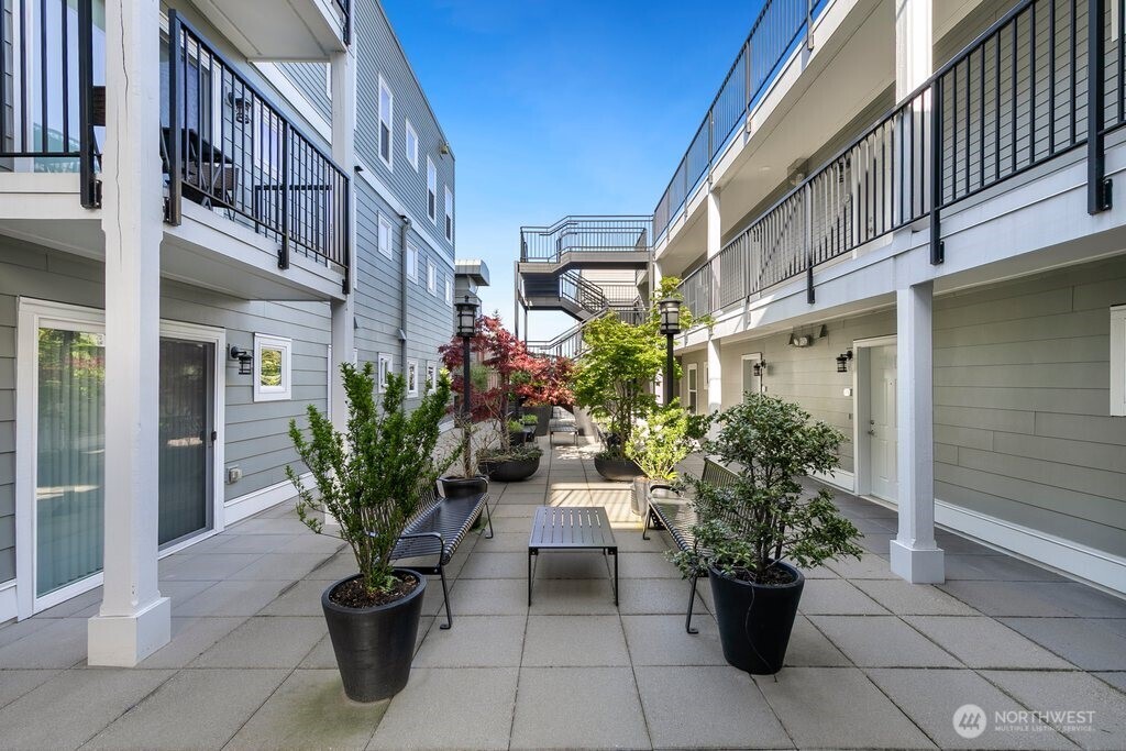2101 North 55th Street, Unit 201 Seattle, WA 98103 - Photo 22 of 24 a view of a building with sitting area