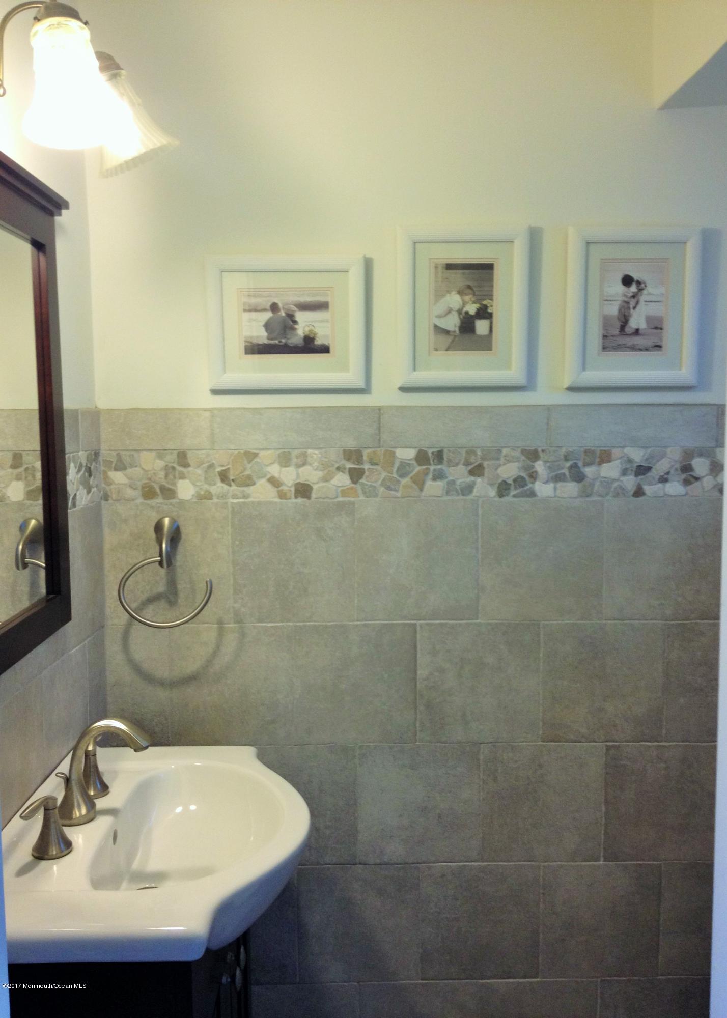 30 Carolyn Road Little Silver, NJ 07739 - Photo 11 of 13 a bathroom with a sink mirror and a shower