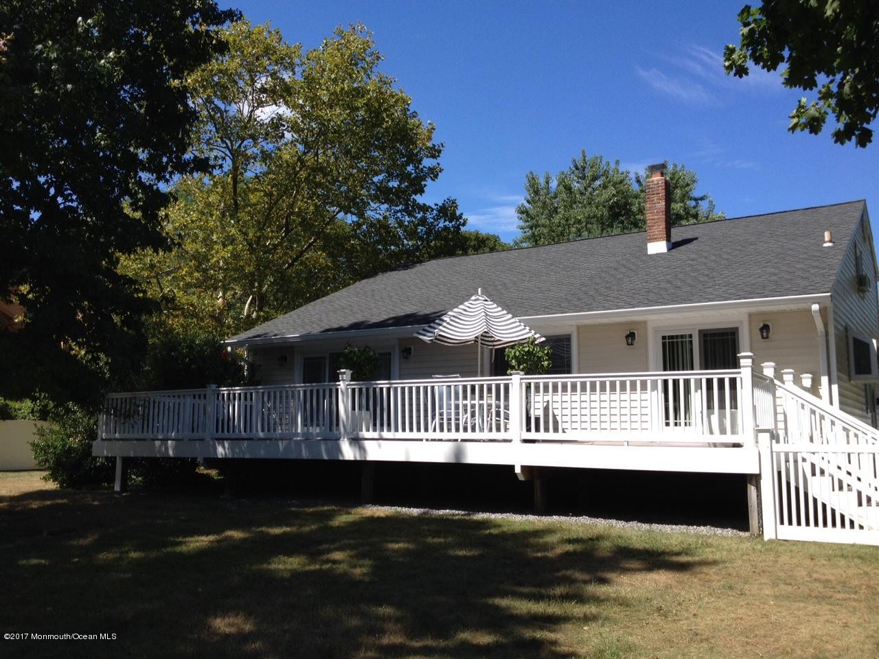 30 Carolyn Road Little Silver, NJ 07739 - Photo 2 of 13 a front view of a house with a garden