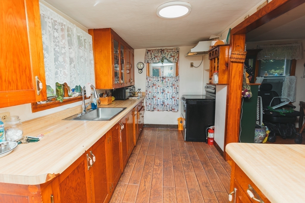 21 River Street Colrain, MA 01340 - Photo 13 of 28 a kitchen with stainless steel appliances granite countertop a sink stove and refrigerator