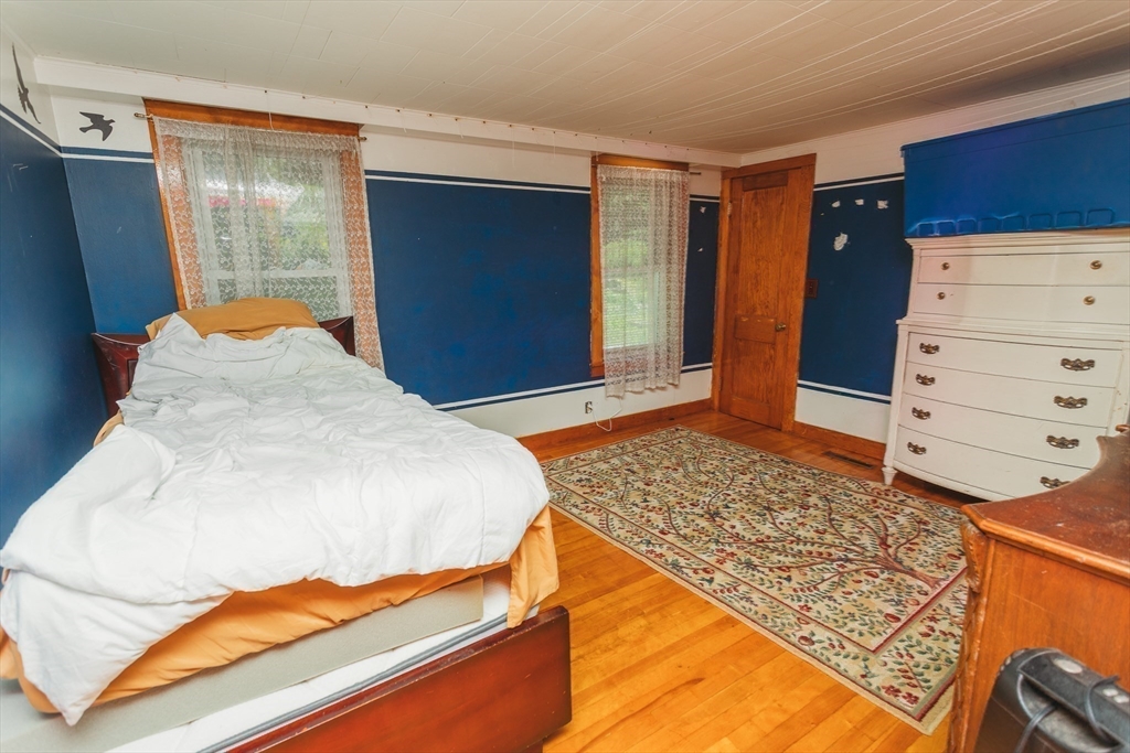 21 River Street Colrain, MA 01340 - Photo 19 of 28 a bedroom with a bed and a dresser
