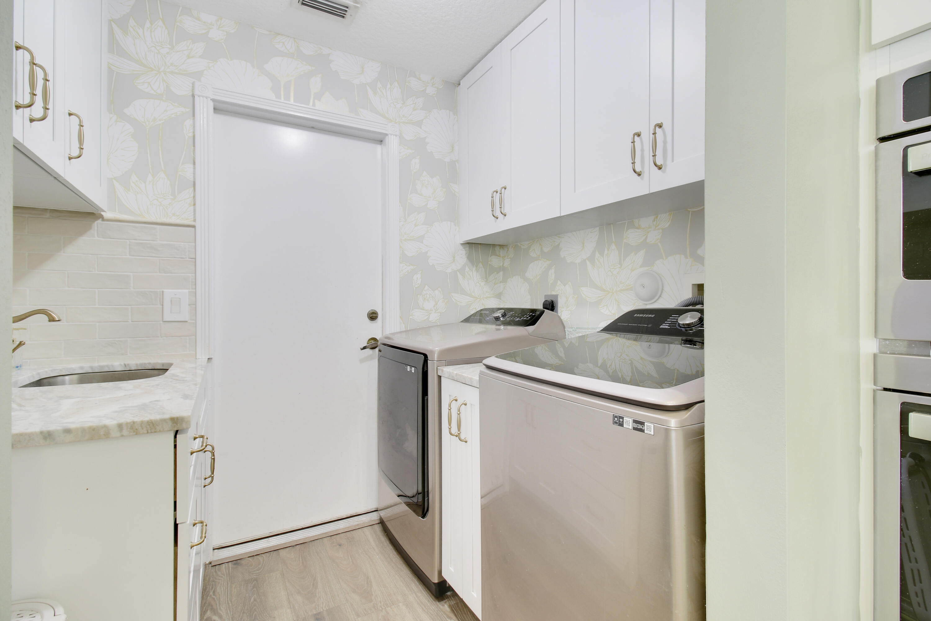 799 Cedar Cove Road Wellington, FL 33414 - Photo 19 of 44 a utility room with dryer and washer