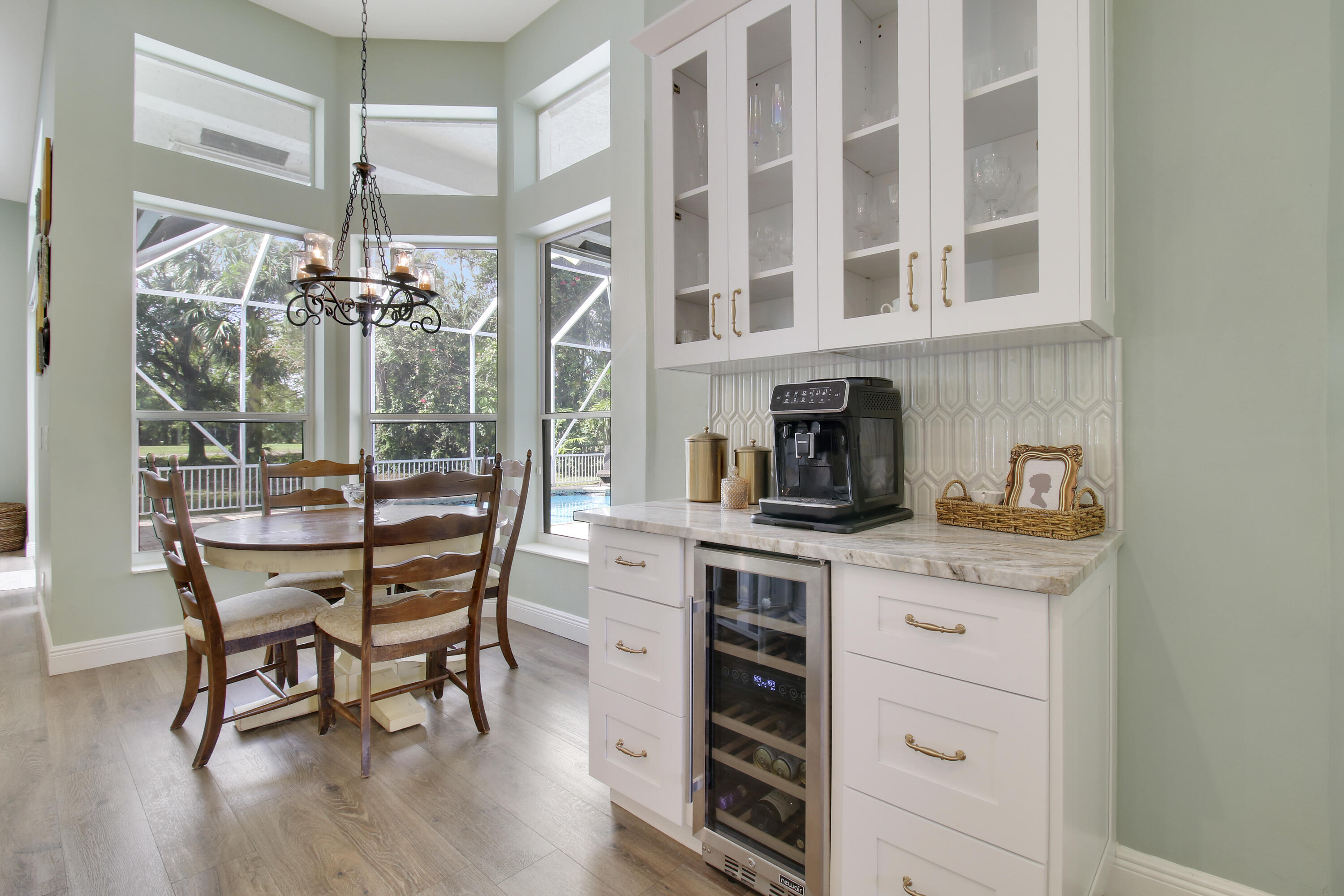 799 Cedar Cove Road Wellington, FL 33414 - Photo 20 of 44 a dining room with a wooden table and chairs