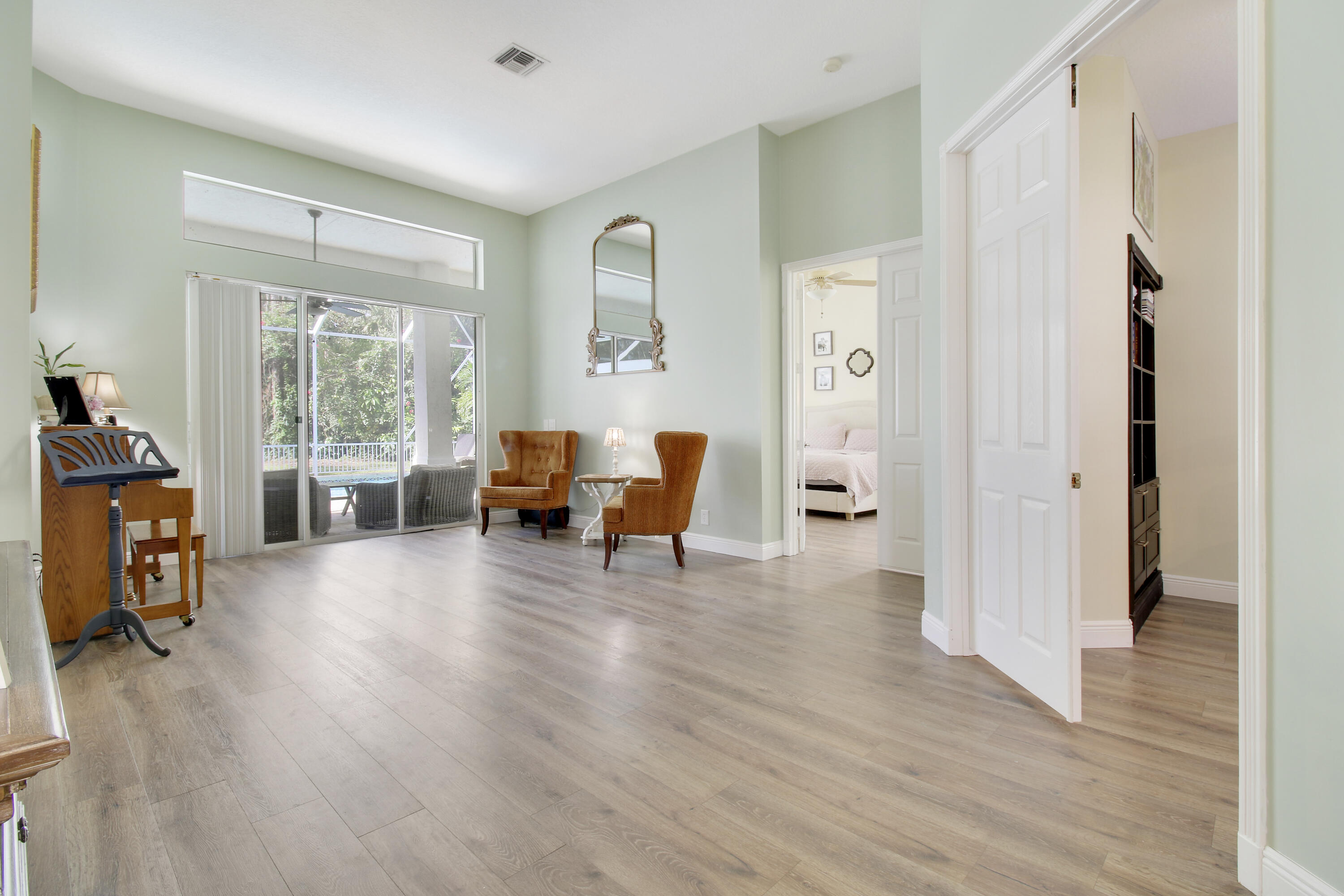 799 Cedar Cove Road Wellington, FL 33414 - Photo 6 of 44 a living room with furniture and a large window