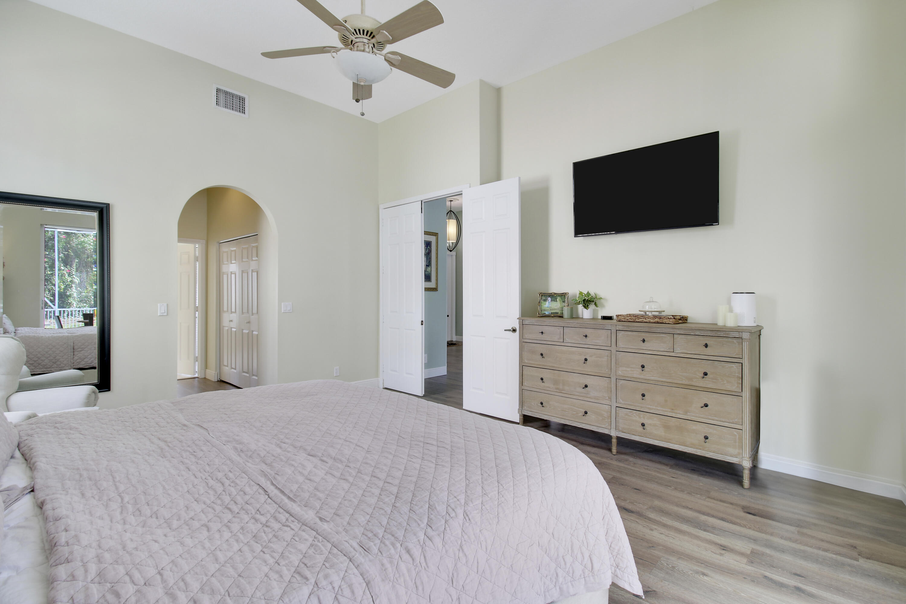 799 Cedar Cove Road Wellington, FL 33414 - Photo 9 of 44 a bedroom with a bed and a flat screen tv