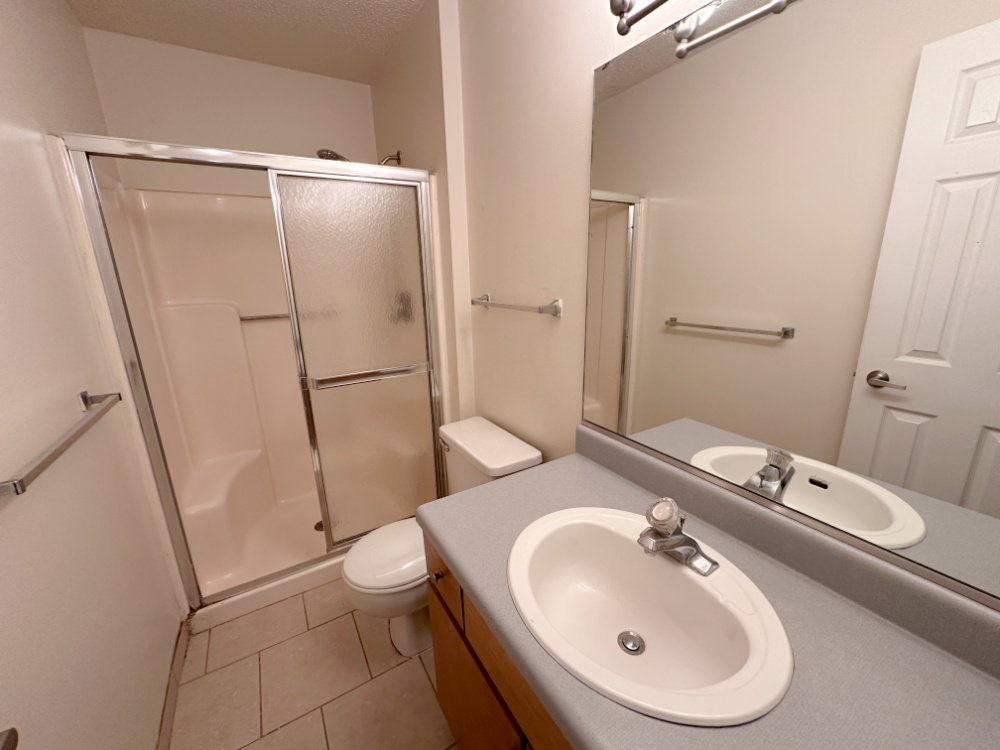 1350 Brook Street, Unit J St. Charles, IL 60174 - Photo 7 of 12 a bathroom with a sink toilet and shower