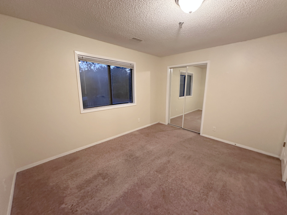1350 Brook Street, Unit J St. Charles, IL 60174 - Photo 8 of 12 a view of an empty room with a window