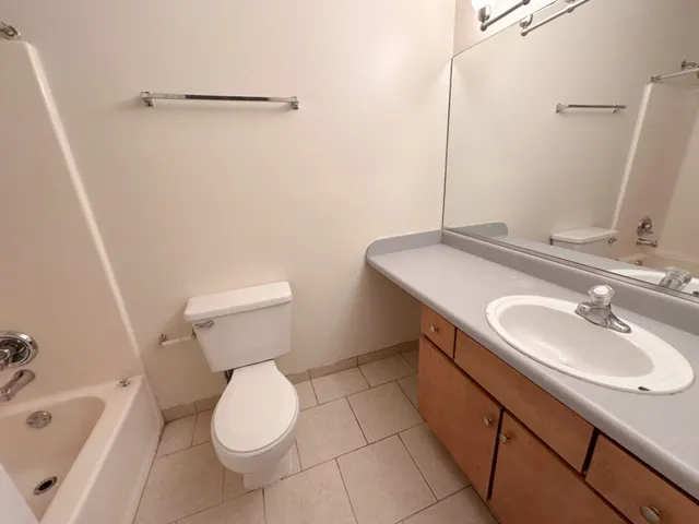 a bathroom with a sink toilet and tub
