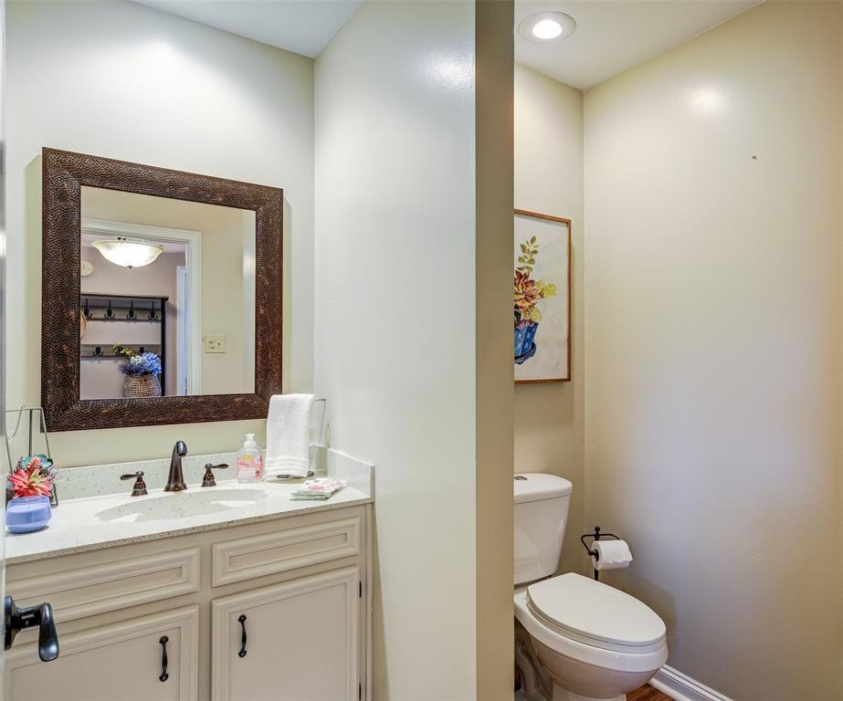 3602 Soft Wind Court Grapevine, TX 76051 - Photo 13 of 31 Half bathroom featuring toilet and vanity