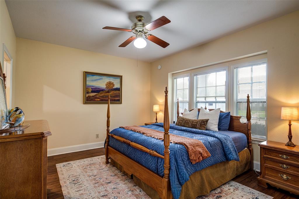 3602 Soft Wind Court Grapevine, TX 76051 - Photo 15 of 31 Bedroom with wood finished floors and ceiling fan