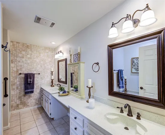 a bathroom with a sink double vanity and a mirror