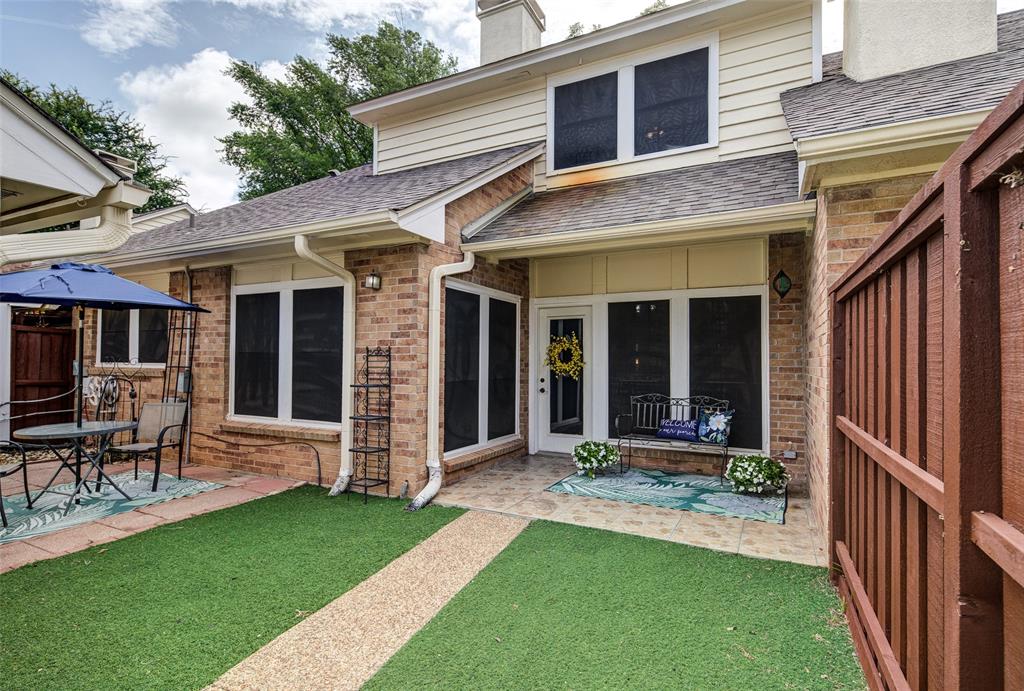 3602 Soft Wind Court Grapevine, TX 76051 - Photo 25 of 31 Rear view of property with a shingled roof, a patio, a chimney, brick siding, and a yard
