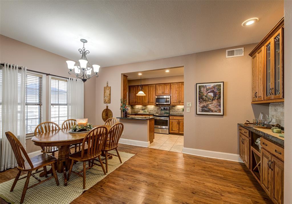 3602 Soft Wind Court Grapevine, TX 76051 - Photo 10 of 31 Dining area with a chandelier, light wood-style floors, and recessed lighting
