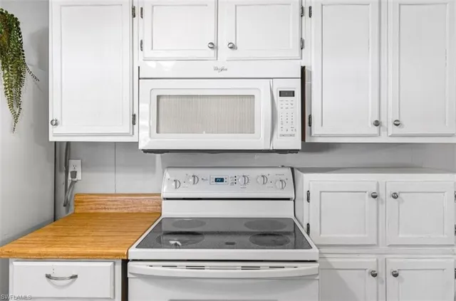 a stove top oven sitting inside of a kitchen
