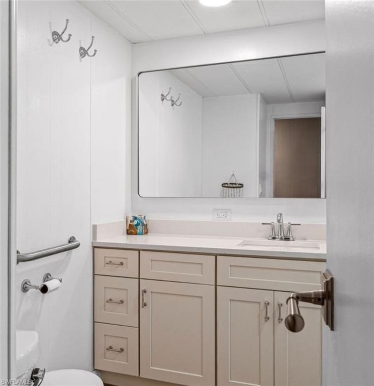 407 Cape Florida Way Naples, FL 34104 - Photo 18 of 27 Bathroom featuring vanity and toilet