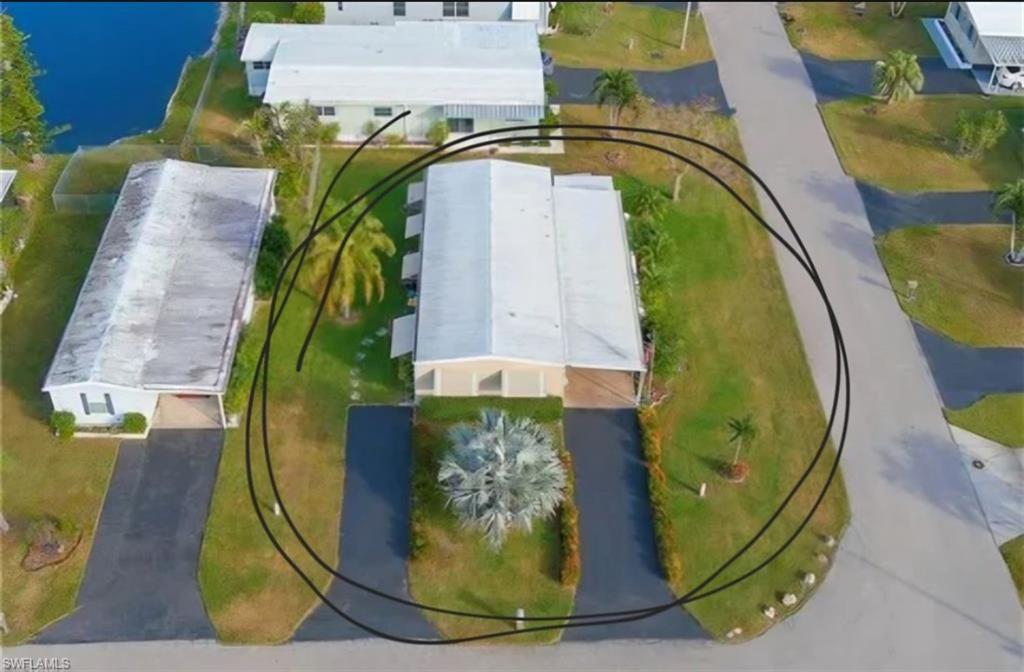 407 Cape Florida Way Naples, FL 34104 - Photo 23 of 27 Drone / aerial view