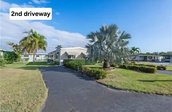 a view of a house with a yard