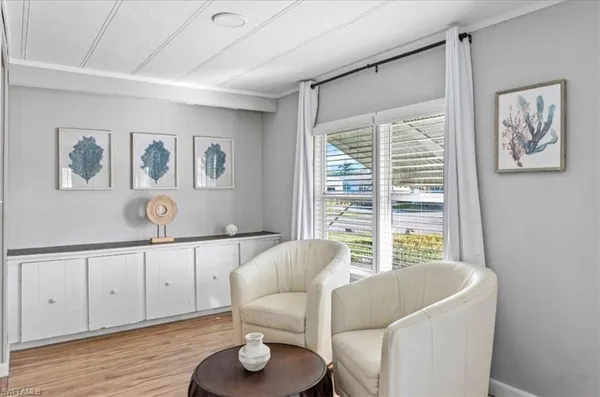 a living room with furniture and a window