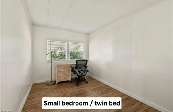 a view of workspace with wooden floor and chair