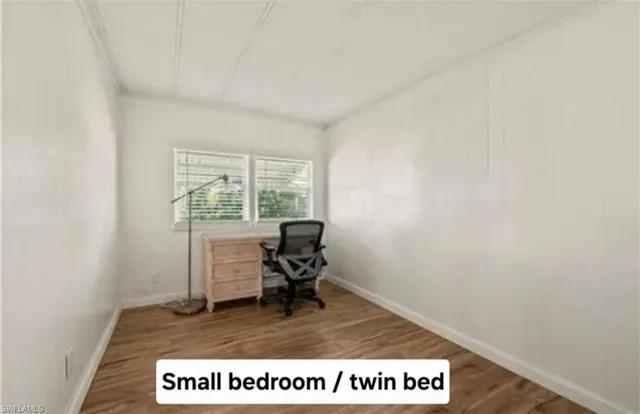 a view of workspace with wooden floor and chair