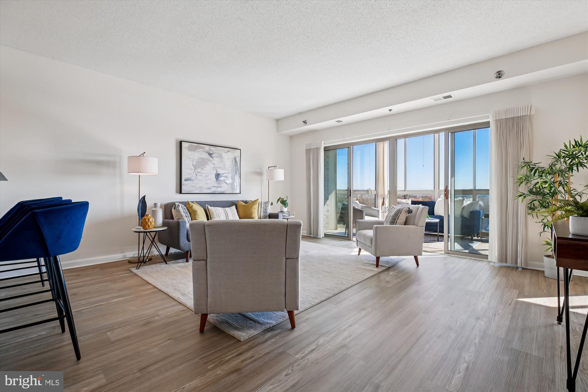 3005 South Leisure World Boulevard, Unit 802 Silver Spring, MD 20906 - Photo 1 of 70 a living room with furniture and a wooden floor