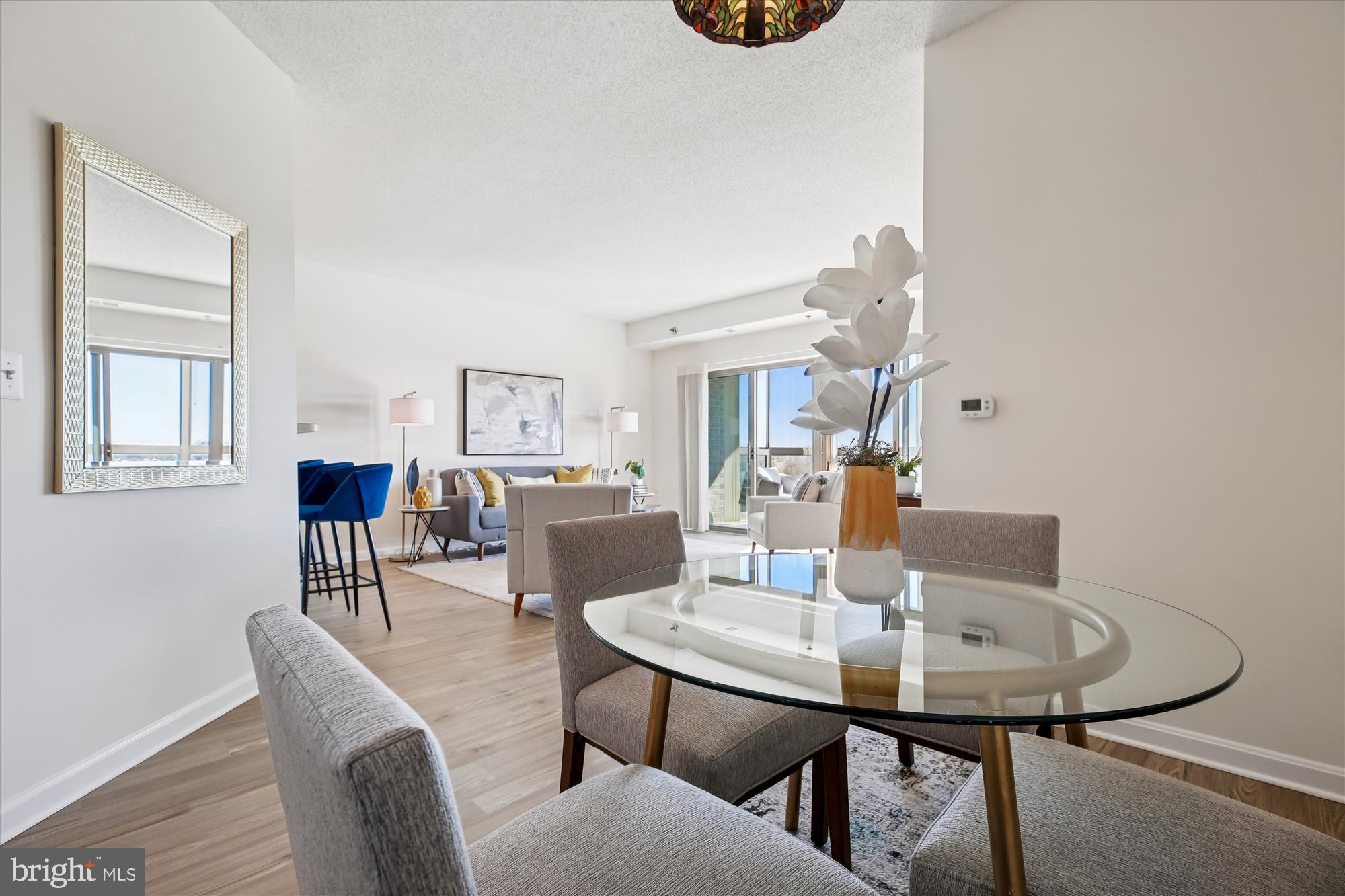 3005 South Leisure World Boulevard, Unit 802 Silver Spring, MD 20906 - Photo 14 of 70 a view of a dining room with furniture and wooden floor
