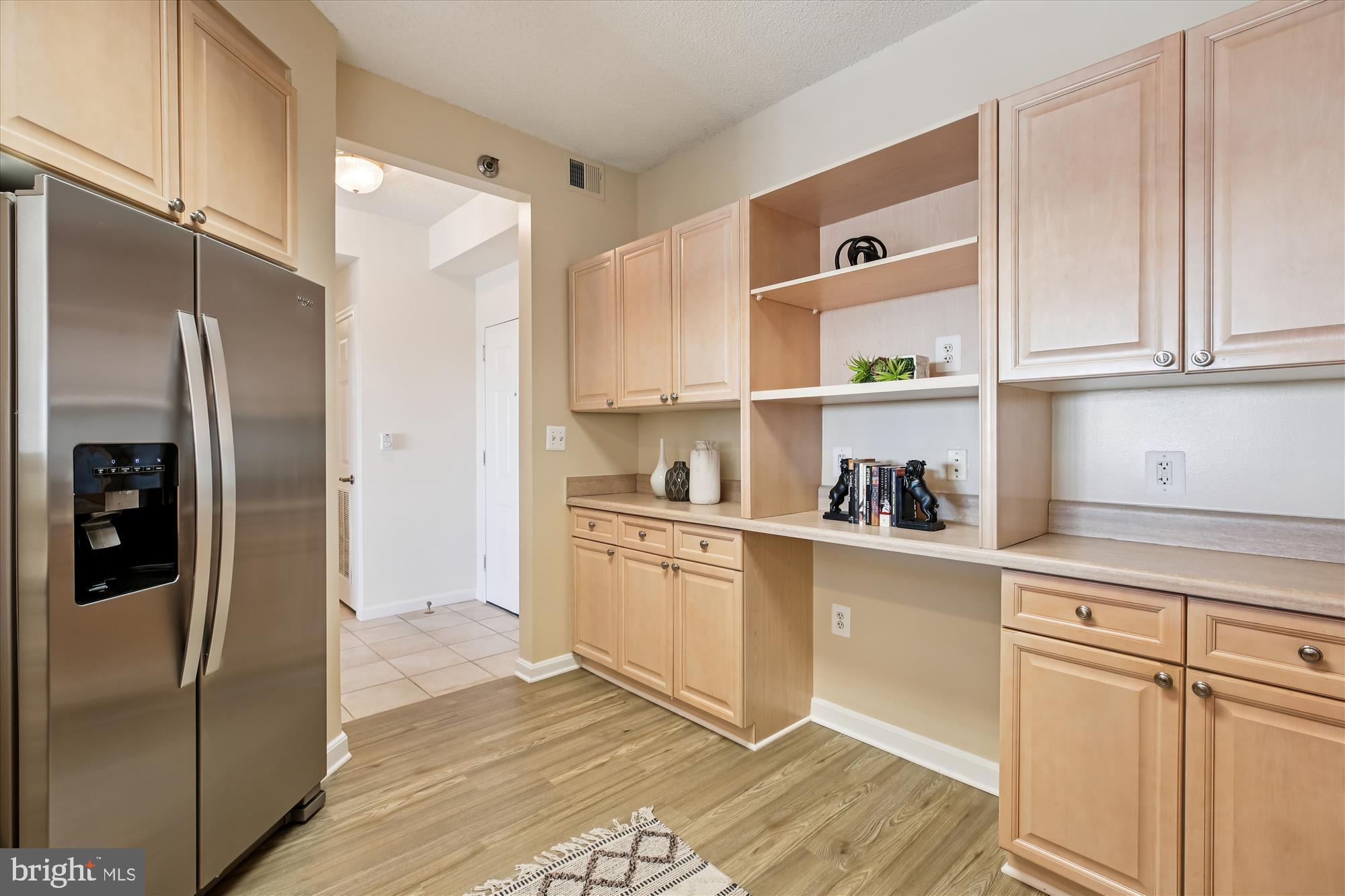 3005 South Leisure World Boulevard, Unit 802 Silver Spring, MD 20906 - Photo 19 of 70 a kitchen with stainless steel appliances granite countertop a refrigerator and a sink