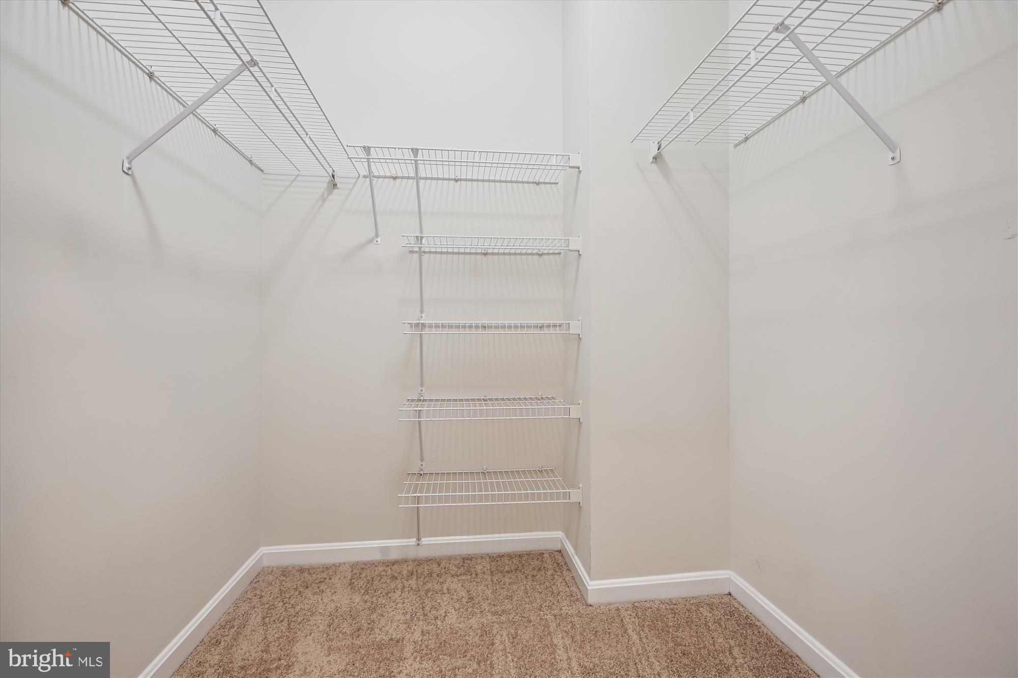 3005 South Leisure World Boulevard, Unit 802 Silver Spring, MD 20906 - Photo 27 of 70 a view of a room with empty racks