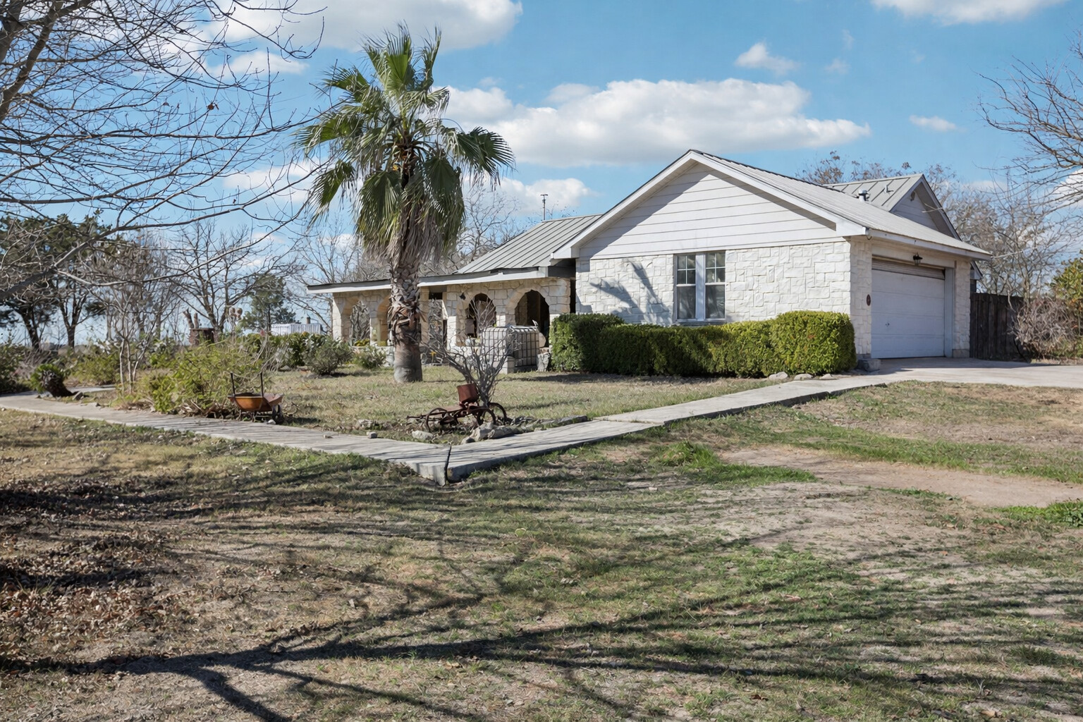 a front view of a house with garden