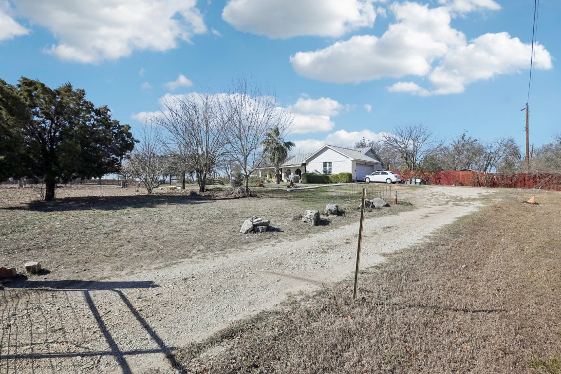 2001 Goforth Road Kyle, TX 78640 - Photo 20 of 34 a view of a dry yard with wooden fence