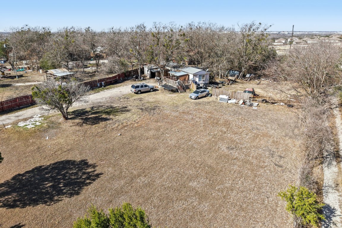 2001 Goforth Road Kyle, TX 78640 - Photo 26 of 34 a view of a backyard with table and chairs