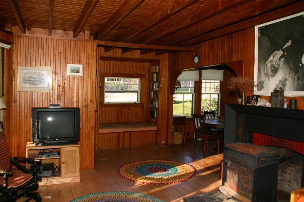 49 Cleeve Street Portland, ME 04109 - Photo 9 of 32 Living room with fireplace beaded...