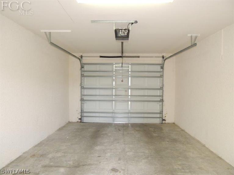 2280 Somerset Ridge Drive, Unit 101 Lehigh Acres, FL 33973 - Photo 11 of 12 a view of walk in closet with empty racks