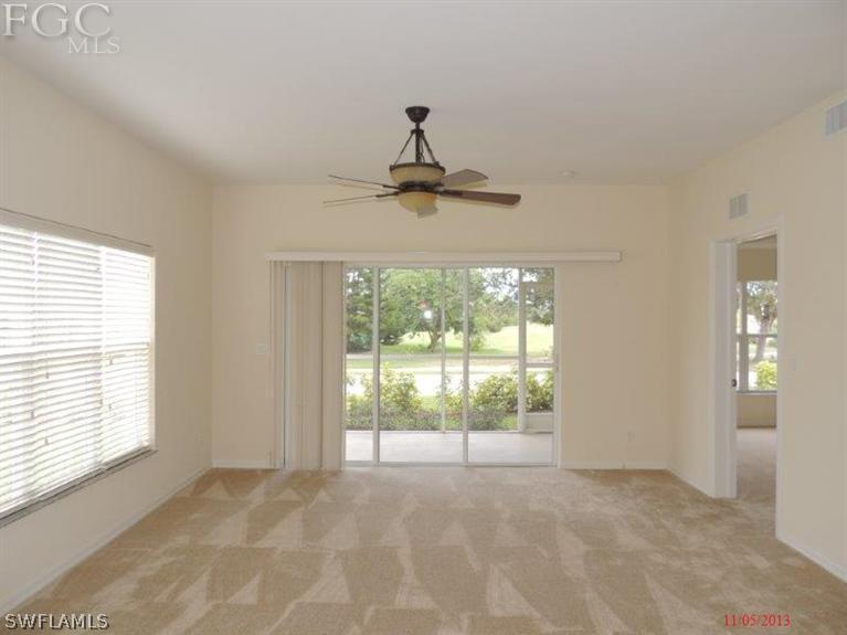 2280 Somerset Ridge Drive, Unit 101 Lehigh Acres, FL 33973 - Photo 3 of 12 a view of an empty room with a window