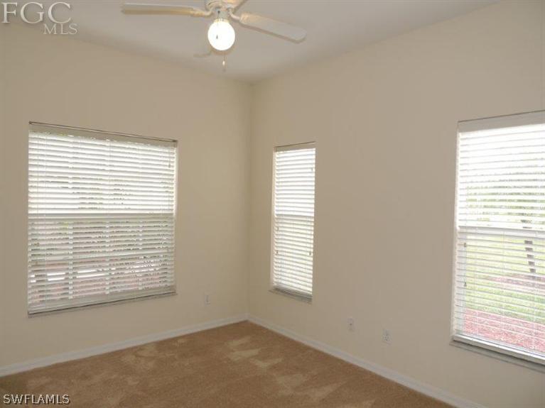 2280 Somerset Ridge Drive, Unit 101 Lehigh Acres, FL 33973 - Photo 6 of 12 a view of an empty room with a window