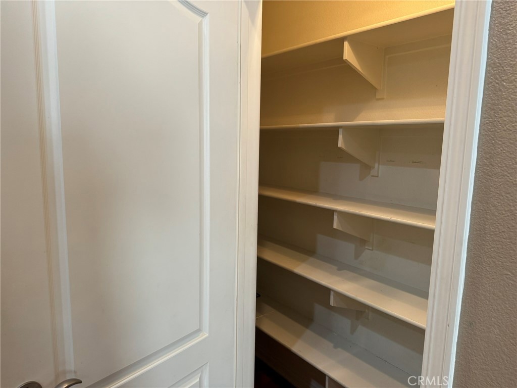 62 Shadowplay Irvine, CA 92620 - Photo 11 of 44 a view of walk in closet with empty racks