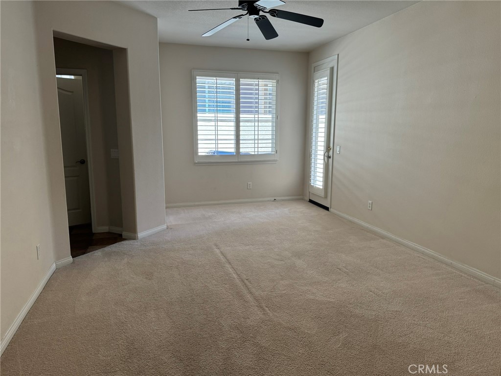 62 Shadowplay Irvine, CA 92620 - Photo 15 of 44 an empty room with a window and a ceiling fan