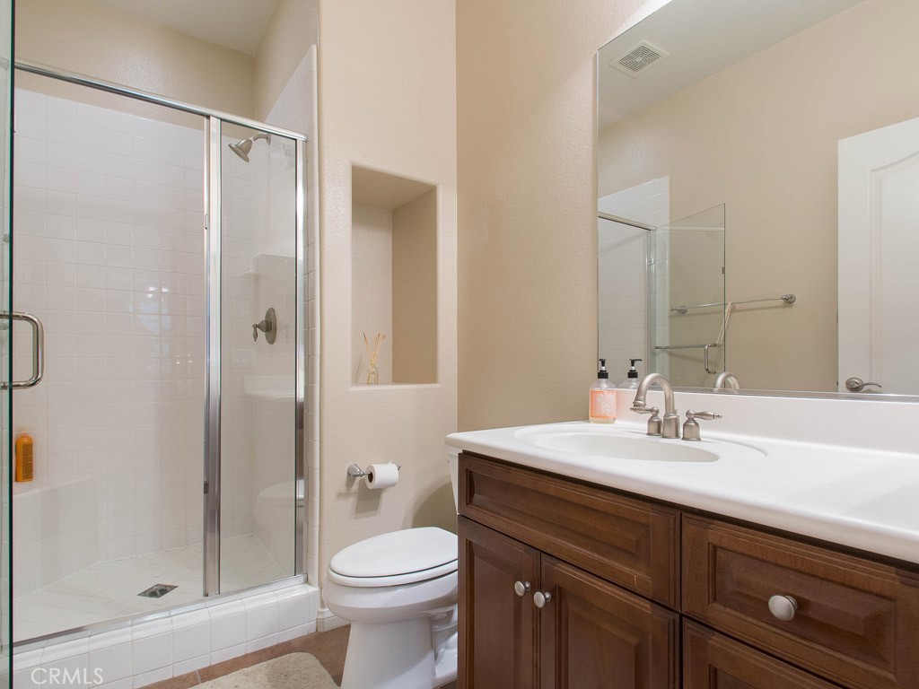 62 Shadowplay Irvine, CA 92620 - Photo 20 of 44 a bathroom with a sink a toilet and shower
