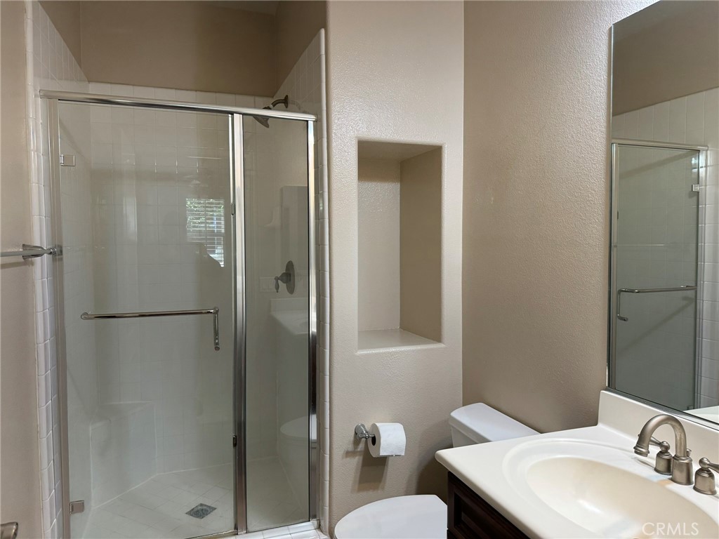 62 Shadowplay Irvine, CA 92620 - Photo 23 of 44 a bathroom with a sink toilet and shower