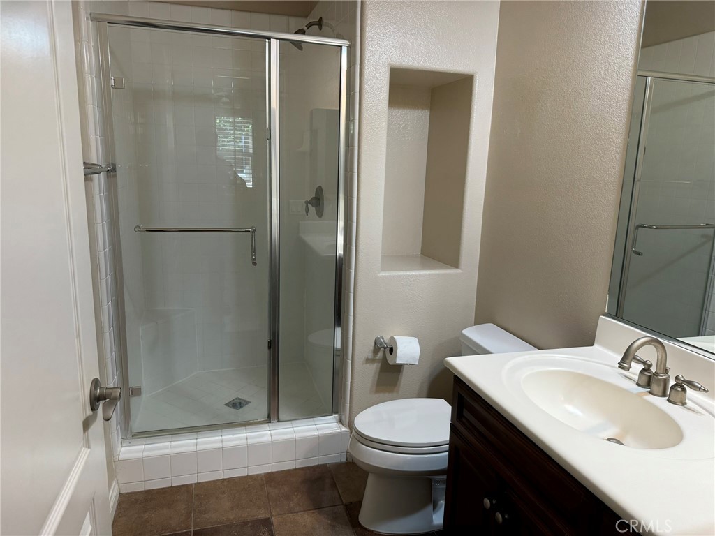 62 Shadowplay Irvine, CA 92620 - Photo 27 of 44 a bathroom with a sink toilet and shower
