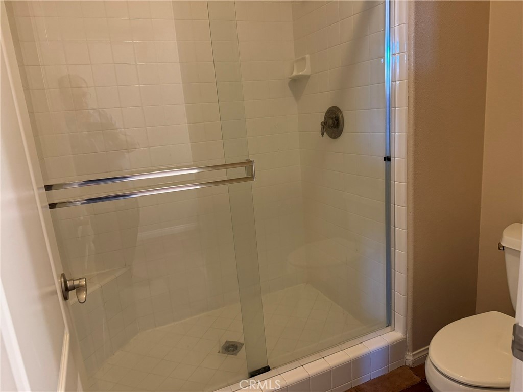 62 Shadowplay Irvine, CA 92620 - Photo 28 of 44 a bathroom with a shower and a toilet