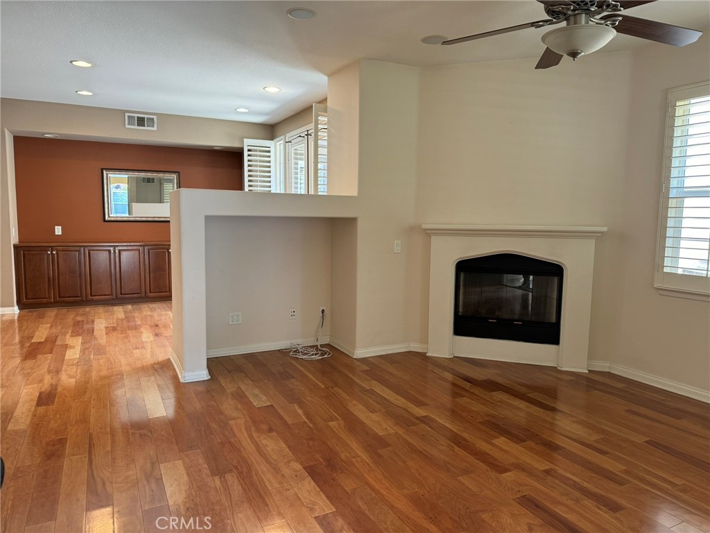 62 Shadowplay Irvine, CA 92620 - Photo 3 of 44 a view of an empty room with a fireplace and a window