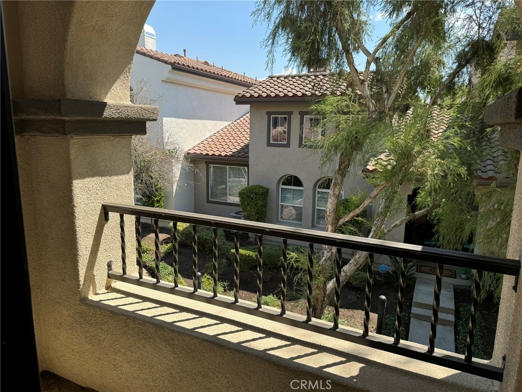 62 Shadowplay Irvine, CA 92620 - Photo 32 of 44 a view of a balcony with a tree
