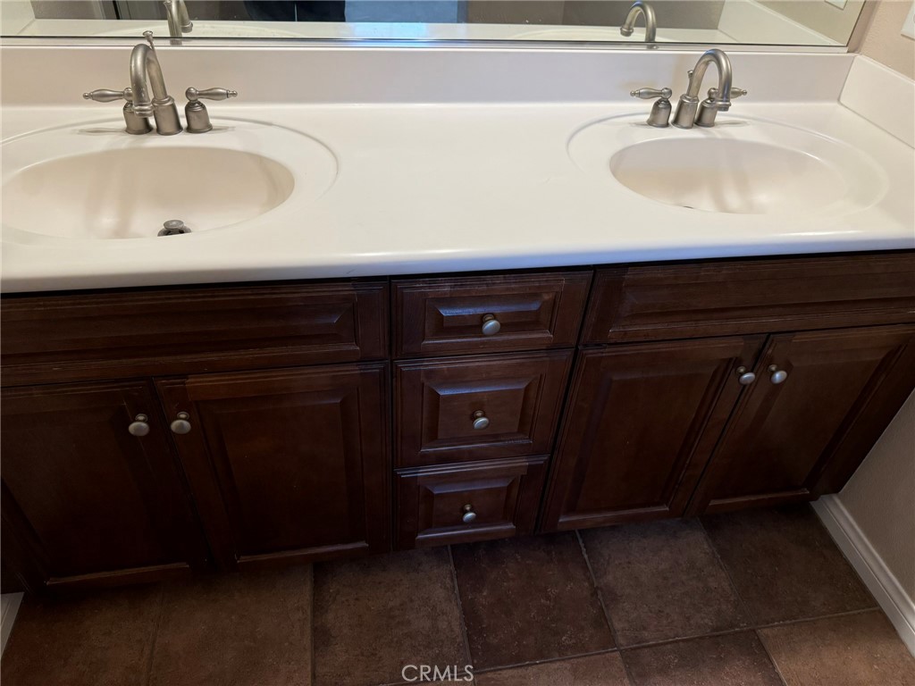 62 Shadowplay Irvine, CA 92620 - Photo 37 of 44 a bathroom with a sink and a mirror