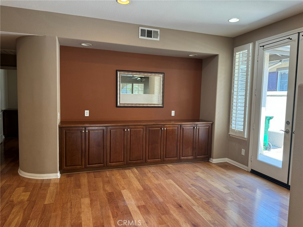 62 Shadowplay Irvine, CA 92620 - Photo 4 of 44 a view of an empty room with wooden floor and a window