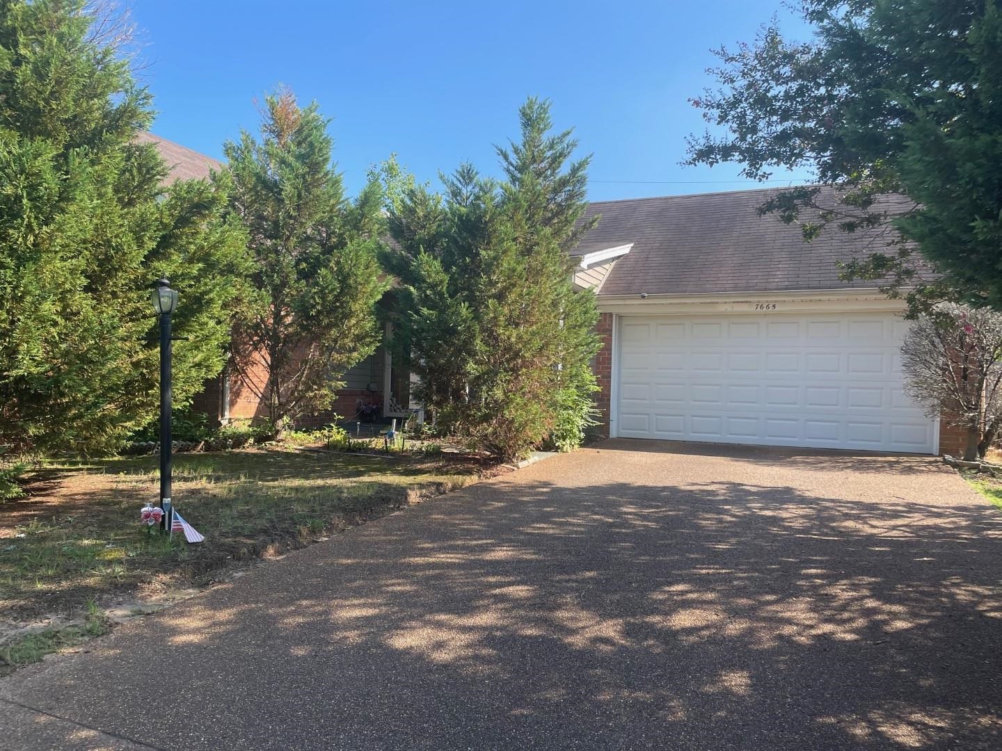 7665 Stone Manor Road Memphis, TN 38125 - Photo 1 of 9 a backyard of a house