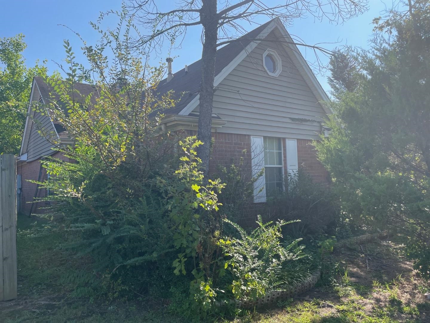 7665 Stone Manor Road Memphis, TN 38125 - Photo 8 of 9 a house with a yard