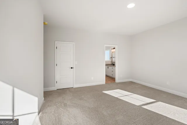 an empty room with a bathroom