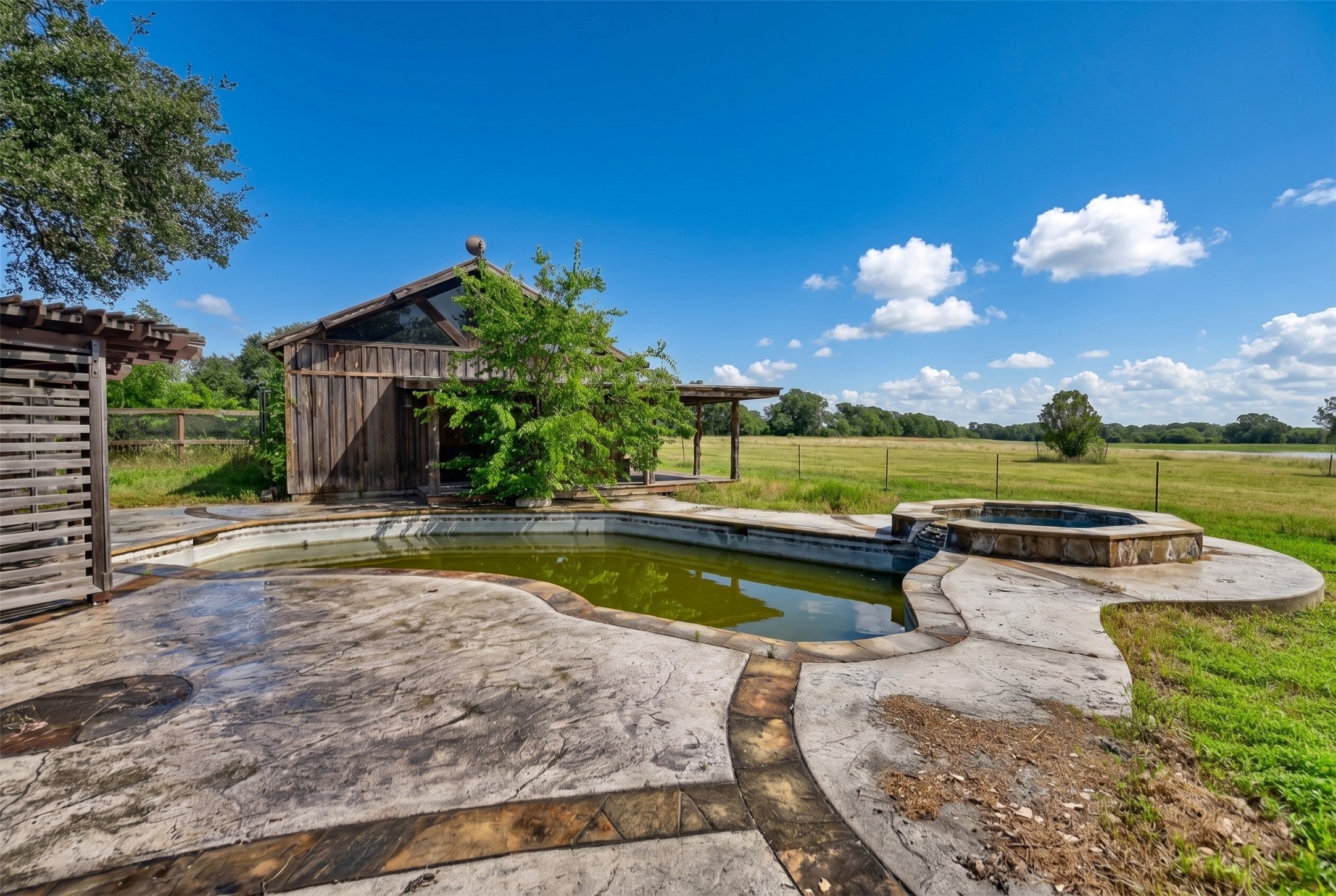 10100 Harmon School Road Burton, TX 77835 - Photo 18 of 26 Pool area with pool house/game room