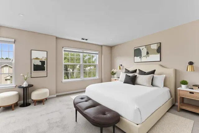 a bedroom with a bed and a couch